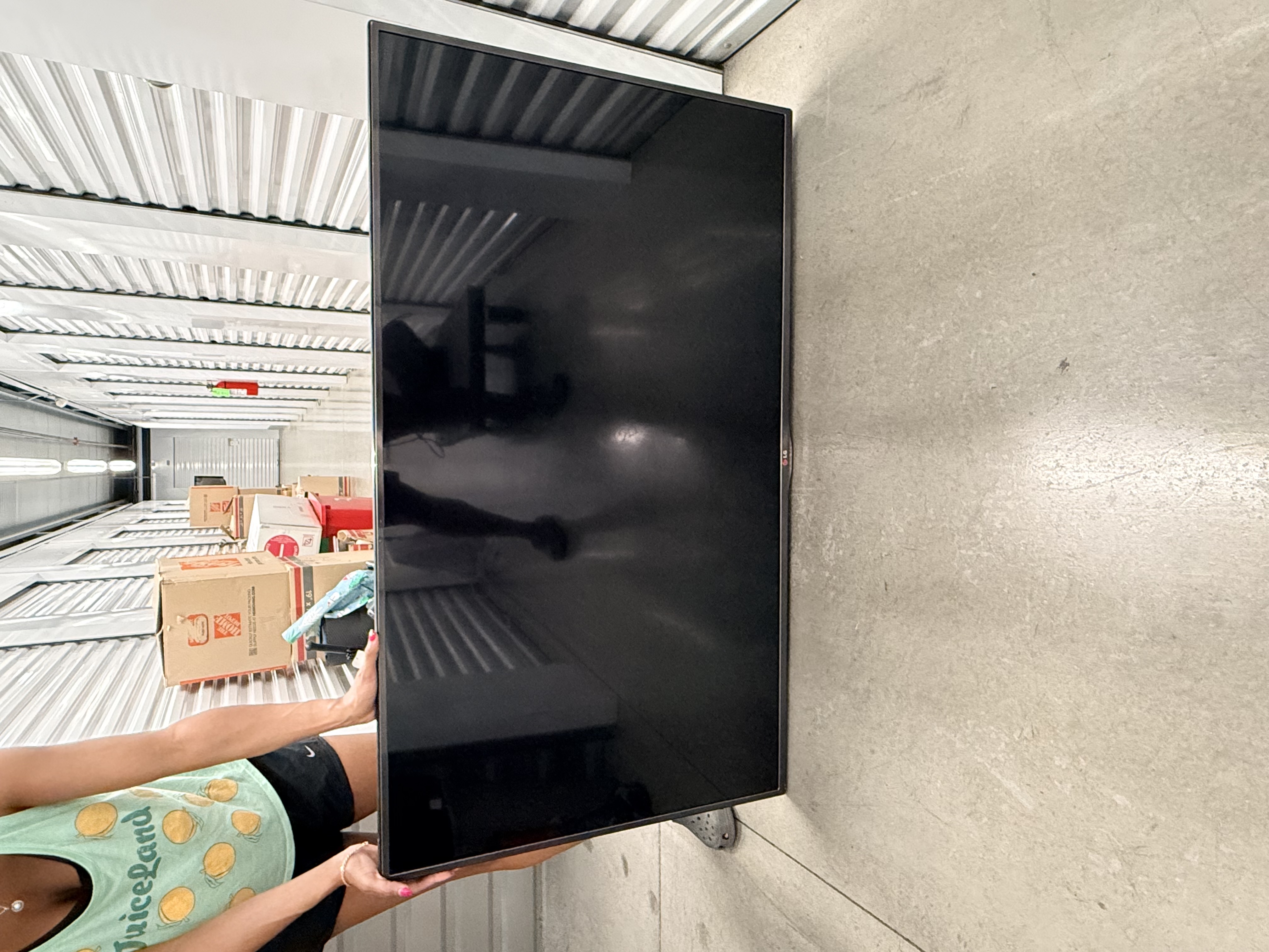55 inch LG TV with remote.